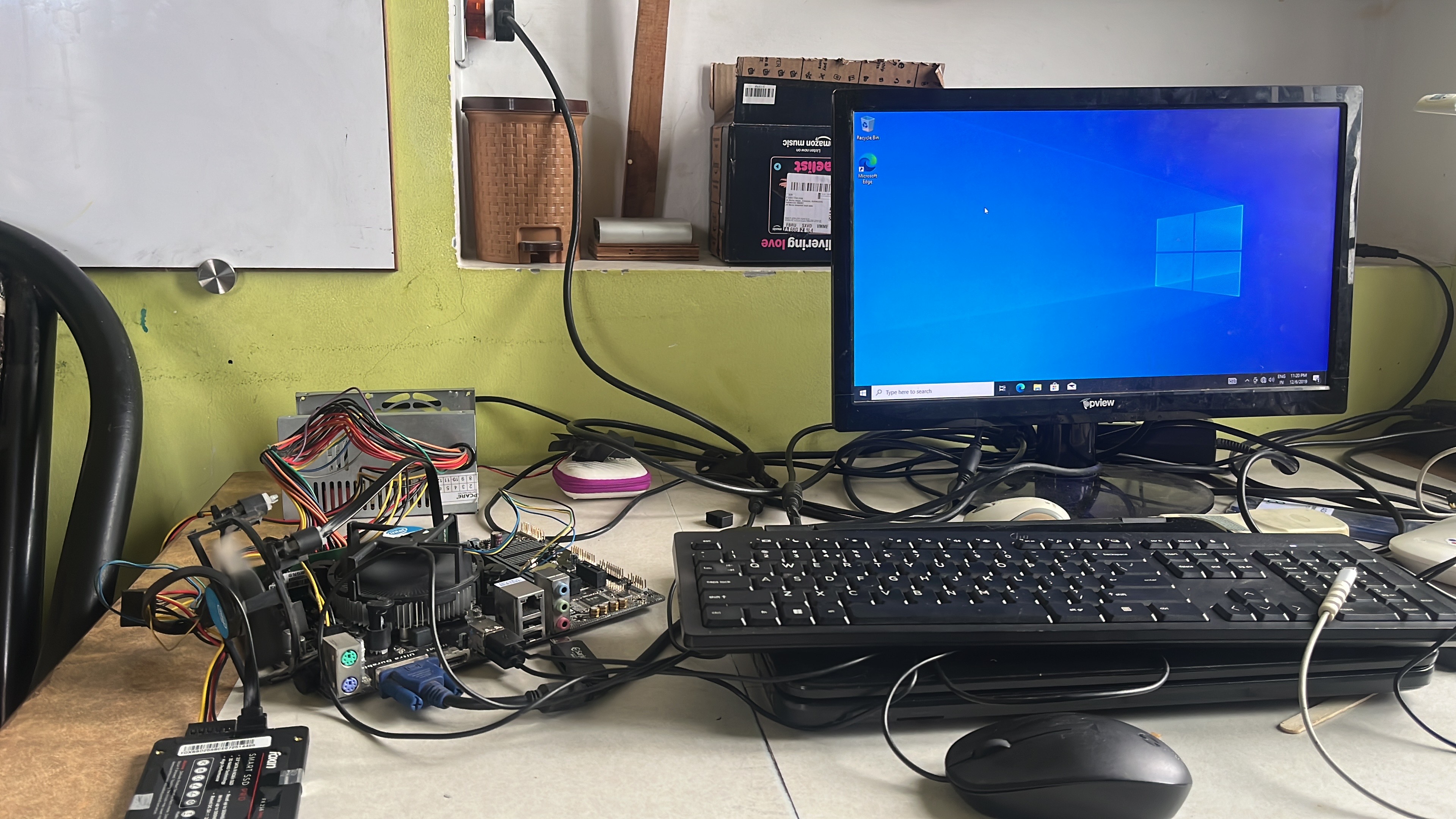 The rebuilt PC booted to a desktop, running open on the bench