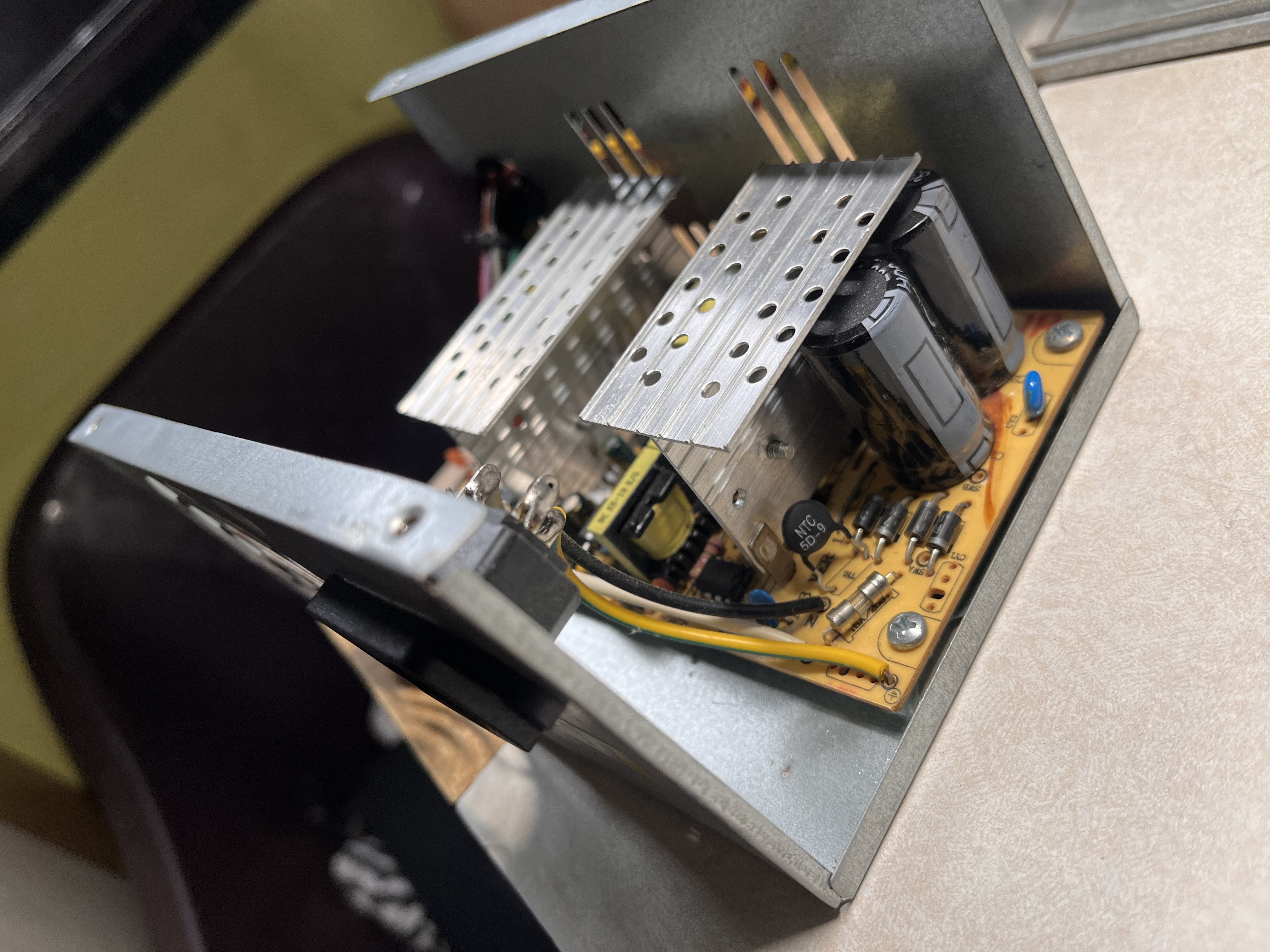 The power supply opened up for the capacitor replacement