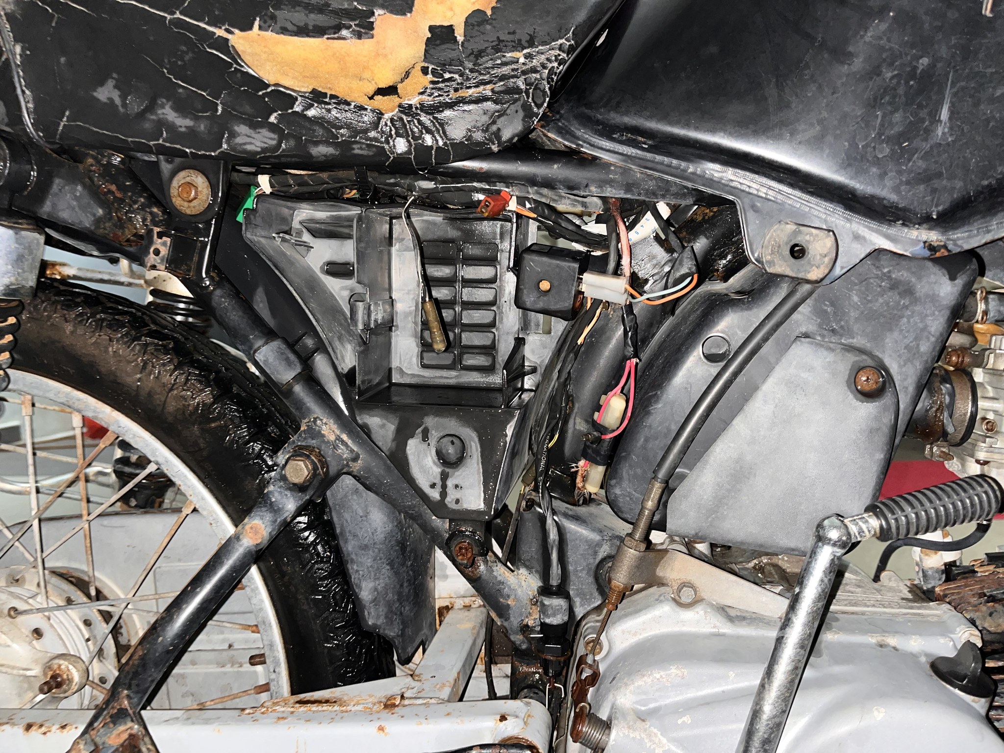 Broken side panel and exposed wiring