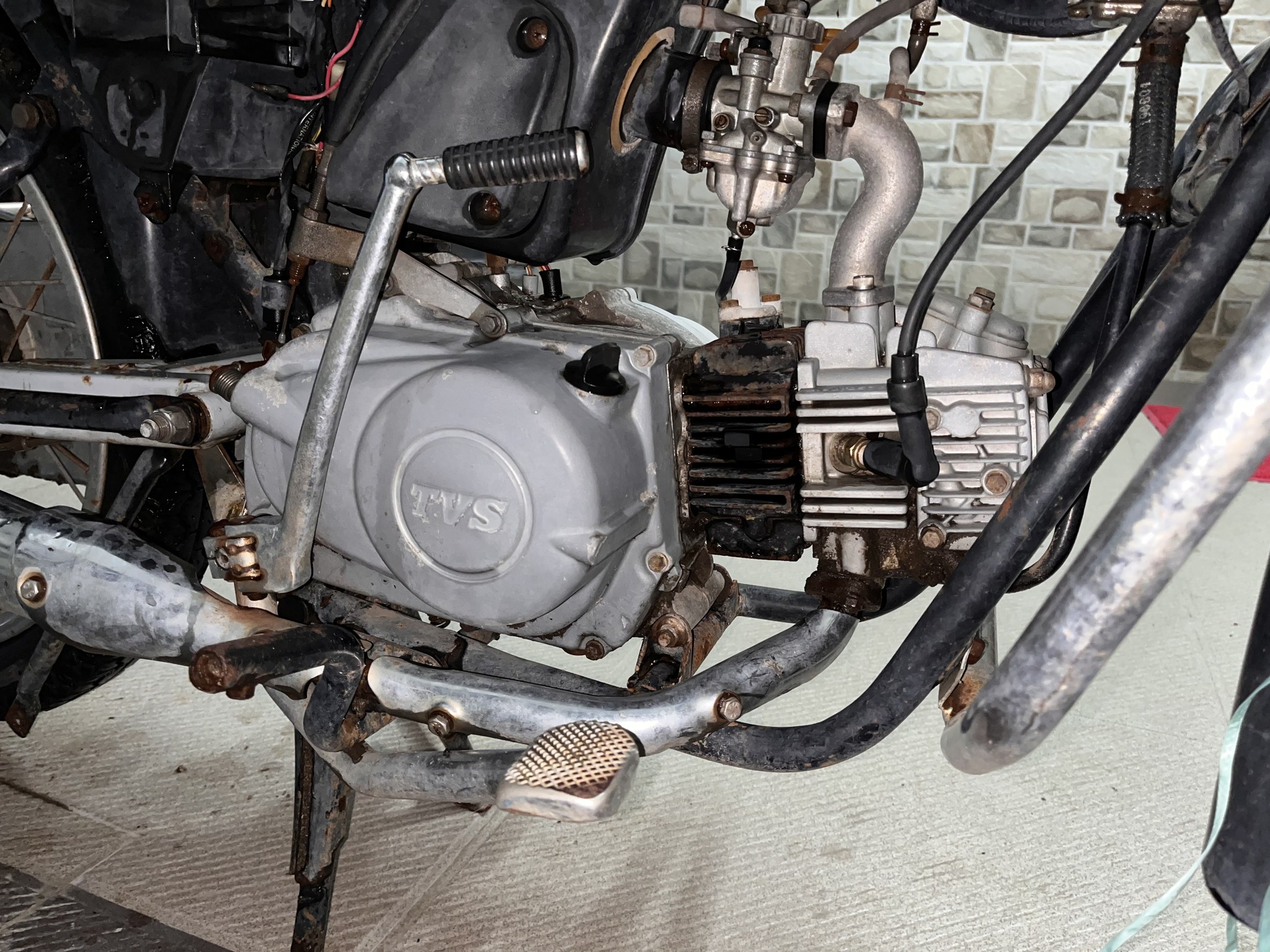 TVS engine, carburetor and center stand