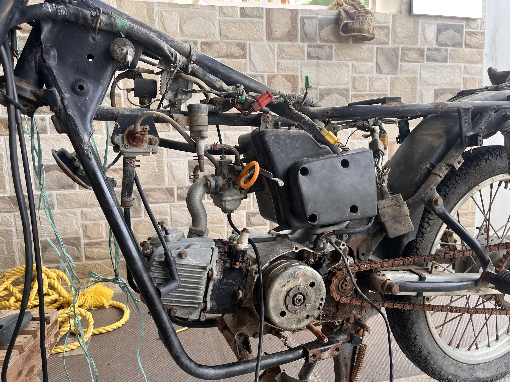 Stripped Centra chassis and engine during teardown