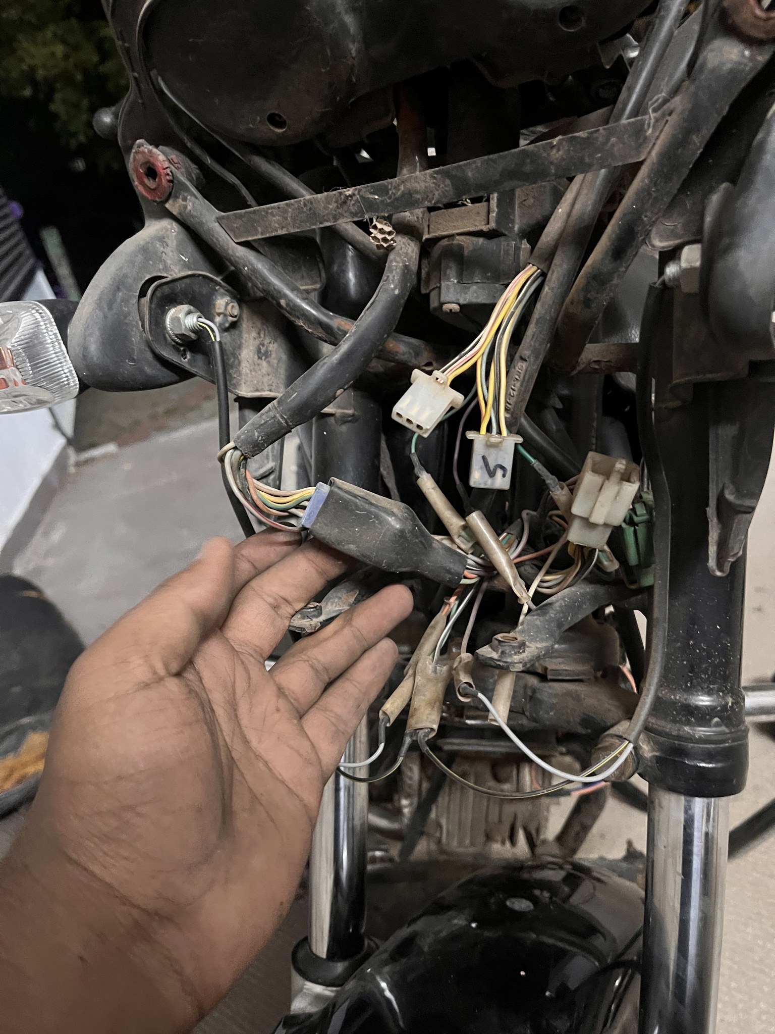 Front wiring harness exposed at handlebar area